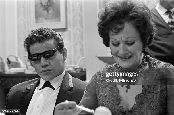 Filming on the set of the film 'Darling'. Unidentified man on the left, and Fanny Cradock on the right. Darling is a 1965 British drama film written...