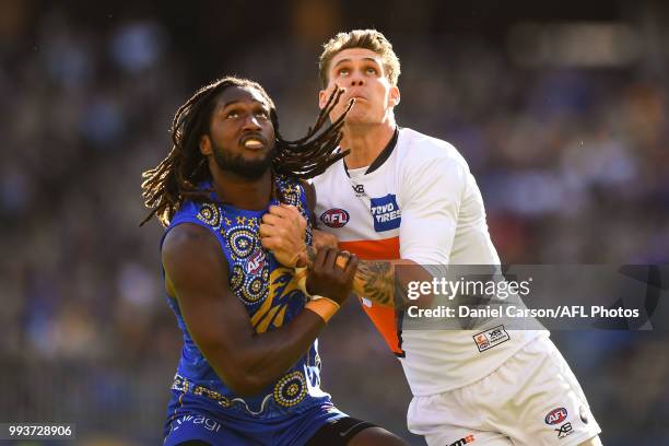 Nic Naitanui of the Eagles contests a boundary throw in against Rory Lobb of the Giants during the 2018 AFL round 16 match between the West Coast...