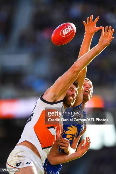 Dawson Simpson of the Giants contests a boundary throw in against Nathan Vardy of the Eagles during the 2018 AFL round 16 match between the West...