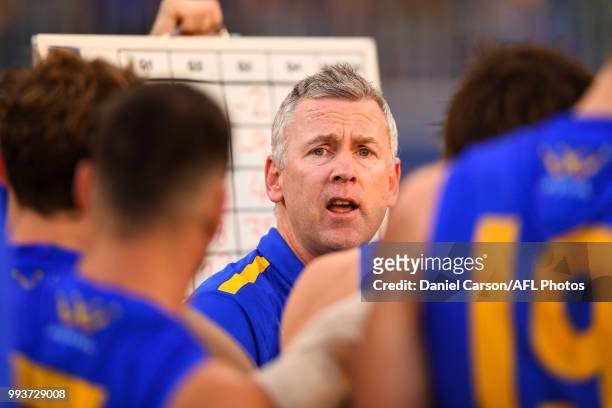 Adam Simpson, coach of the Eagles addresses the team at three quarter time during the 2018 AFL round 16 match between the West Coast Eagles and the...
