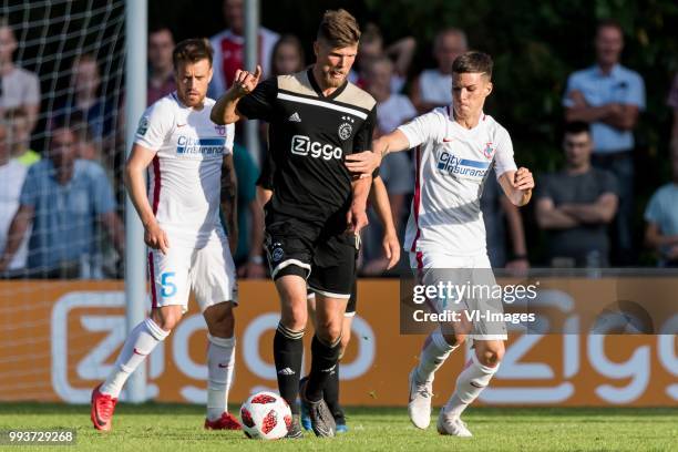 Mihai Pintilii of Steaua Bucharest, Klaas Jan Huntelaar of Ajax, Dennis Man of Steaua Bucharest during the friendly match between Ajax Amsterdam and...