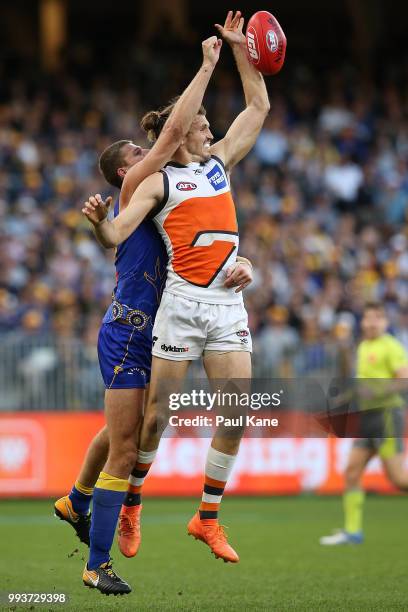 Nathan Vardy of the Eagles spoils the mark for Phil Davis of the Giants during the round 16 AFL match between the West Coast Eagles and the Greater...