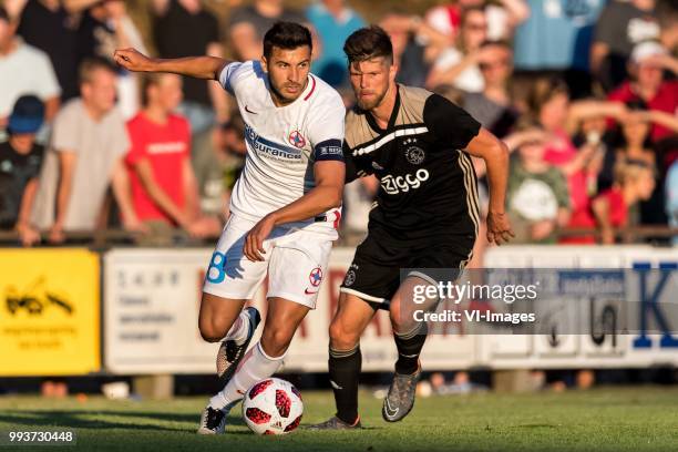 Lucian Filip of Steaua Bucharest, Klaas Jan Huntelaar of Ajax during the friendly match between Ajax Amsterdam and Steaua Bucharest on July 7, 2018...