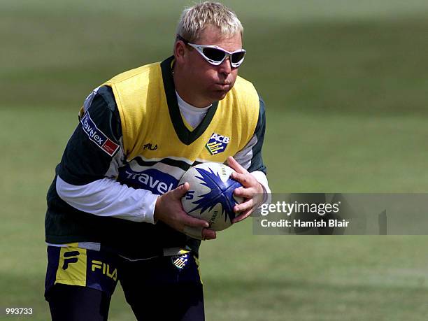 Shane Warne of Australia catches a rugby ball, during training at Glamorgan County Cricket Ground, Cardiff, Wales. DIGITAL IMAGE Mandatory Credit:...