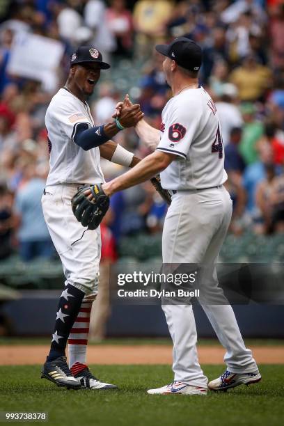 Keon Broxton and Corey Knebel of the Milwaukee Brewers celebrate after beating the Minnesota Twins 3-2 at Miller Park on July 4, 2018 in Milwaukee,...