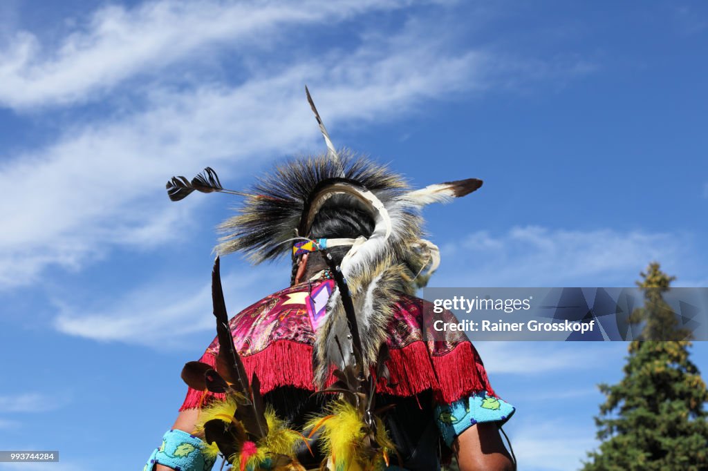 Native Americans in traditional dress at pow-wow