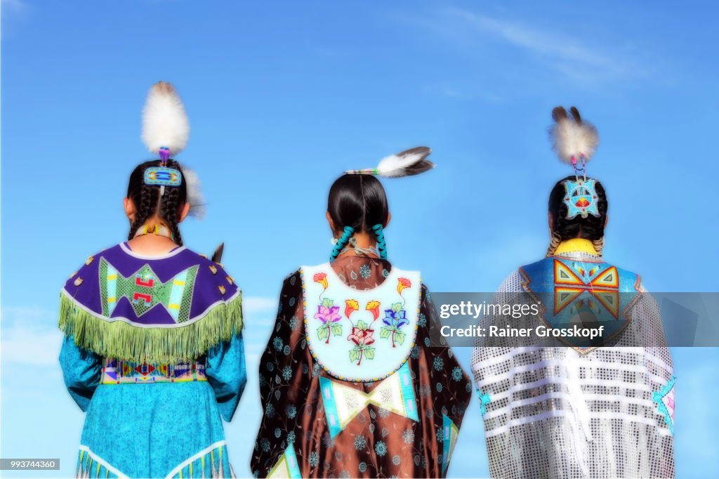 Native Americans in traditional dress at pow-wow