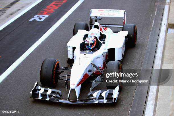 Santander UK ambassador Jenson Button takes British motorcycle legend Guy Martin for a lap of the 2018 F1 British Grand Prix at Silverstone Circuit...