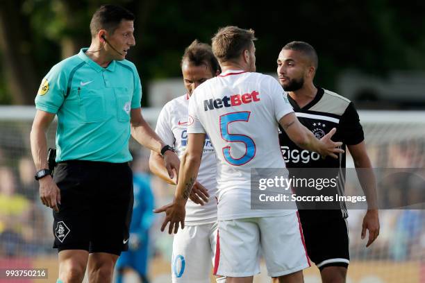 Referee Jeroen Manschot, Filipe Teixeira of Steaua Bucharest, Mihai Pintilii of Steaua Bucharest, Zakaria Labyad of Ajax during the Club Friendly...