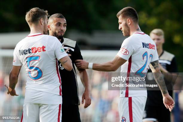 Mihai Pintilii of Steaua Bucharest, Zakaria Labyad of Ajax, Ovidiu Popescu of Steaua Bucharest during the Club Friendly match between Ajax v Steaua...