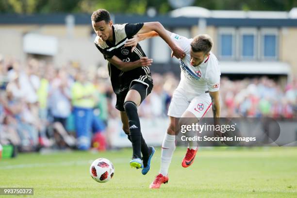 Noussair Mazraoui of Ajax, Mihai Pintilii of Steaua Bucharest during the Club Friendly match between Ajax v Steaua Bucharest at the Sportpark 't...