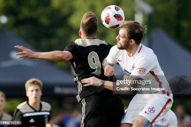 Klaas Jan Huntelaar of Ajax, Mihai Balasa of Steaua Bucharest during the Club Friendly match between Ajax v Steaua Bucharest at the Sportpark 't...