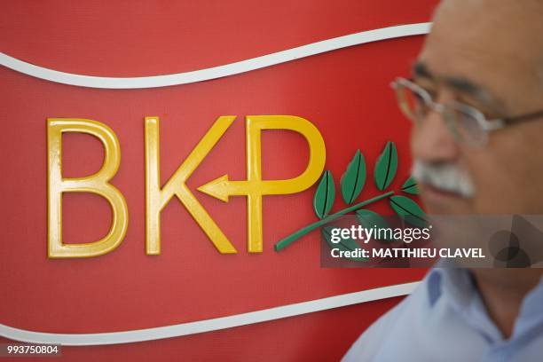 Former member of parliament and founder of the socialist United Cyprus Party Izzet Izcan speaks during an interview at his party's headquarters in...