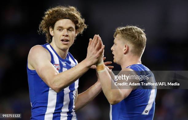 Ben Brown of the Kangaroos celebrates a goal with Jack Ziebell of the Kangaroos during the 2018 AFL round 16 match between the North Melbourne...
