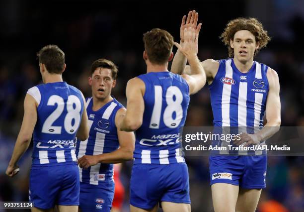 Ben Brown of the Kangaroos celebrates a goal with Shaun Atley of the Kangaroos during the 2018 AFL round 16 match between the North Melbourne...