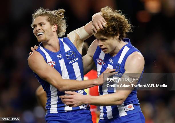 Ben Brown of the Kangaroos celebrates a goal with Jed Anderson of the Kangaroos during the 2018 AFL round 16 match between the North Melbourne...
