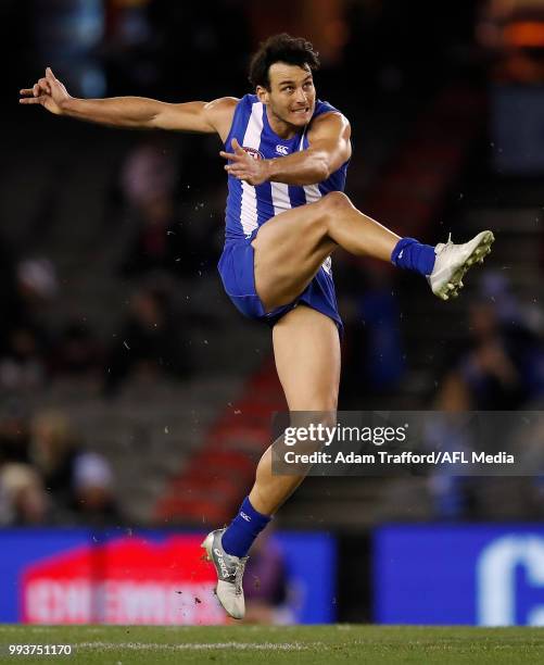 Robbie Tarrant of the Kangaroos kicks the ball during the 2018 AFL round 16 match between the North Melbourne Kangaroos and the Gold Coast Suns at...