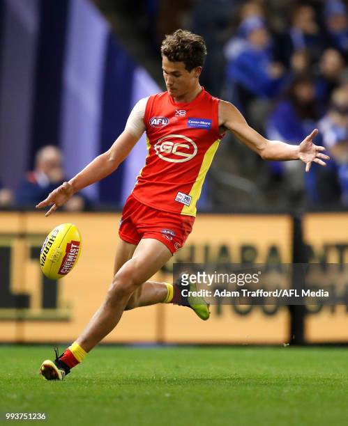 Wil Powell of the Suns kicks the ball during the 2018 AFL round 16 match between the North Melbourne Kangaroos and the Gold Coast Suns at Etihad...