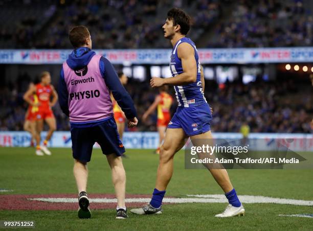 Robbie Tarrant of the Kangaroos is seen injured during the 2018 AFL round 16 match between the North Melbourne Kangaroos and the Gold Coast Suns at...