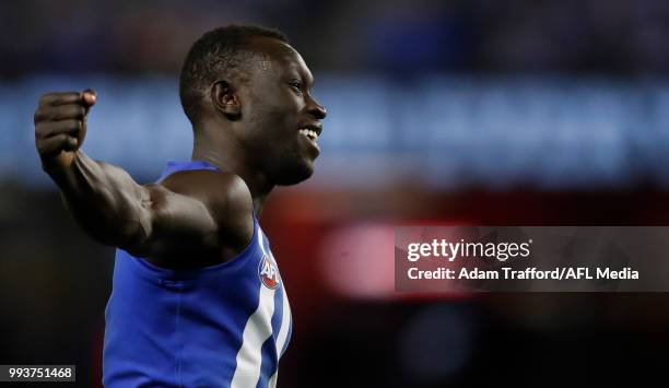 Majak Daw of the Kangaroos celebrates a goal during the 2018 AFL round 16 match between the North Melbourne Kangaroos and the Gold Coast Suns at...