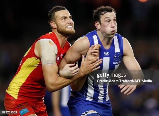 Jarrod Witts of the Suns and Todd Goldstein of the Kangaroos compete in a ruck contest during the 2018 AFL round 16 match between the North Melbourne...