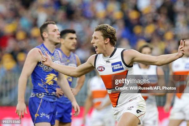 Lachie Whitfield of the Giants celebrates after scoring a goal during the round 16 AFL match between the West Coast Eagles and the Greater Western...