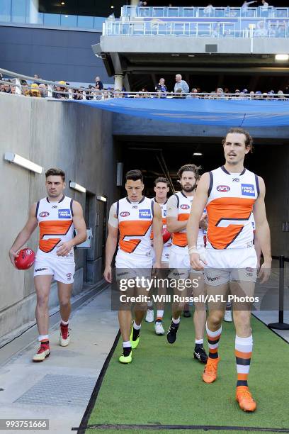 Phil Davis of the Giants leads the team out during the round 16 AFL match between the West Coast Eagles and the Greater Western Sydney Giants at...