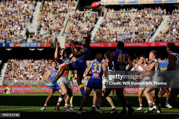 Nic Naitanui of the Eagles taps the ball during the round 16 AFL match between the West Coast Eagles and the Greater Western Sydney Giants at Optus...