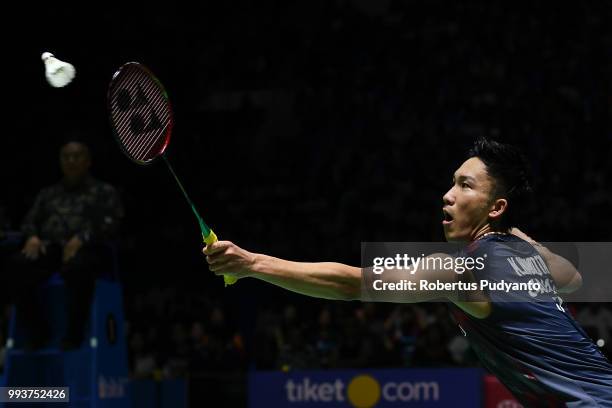 Kento Momota of Japan competes against Viktor Axelsen of Denmark during the Men's Singles Final match on day six of the Blibli Indonesia Open at...