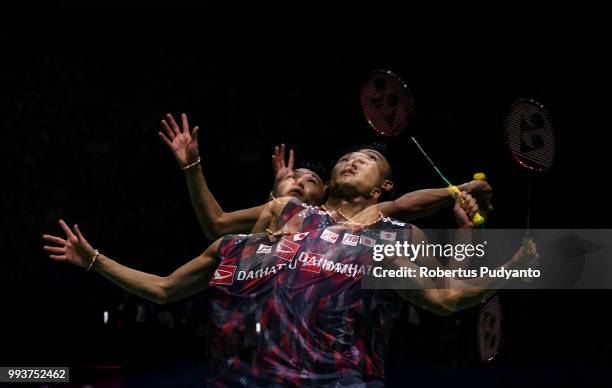 Kento Momota of Japan competes against Viktor Axelsen of Denmark during the Men's Singles Final match on day six of the Blibli Indonesia Open at...