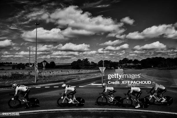 Great Britain's Christopher Froome trains with his Great Britain's Team Sky cycling team teammates on July 4, 2018 near Saint-Macaire-en-Mauges,...