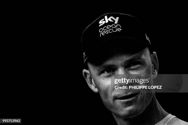Great Britain's Christopher Froome of Great Britain's Team Sky cycling team poses on stage during the team presentation ceremony on July 5, 2018 in...