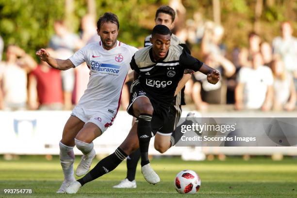 Filipe Teixeira of Steaua Bucharest, Ryan Gravenberch of Ajax during the Club Friendly match between Ajax v Steaua Bucharest at the Sportpark 't...