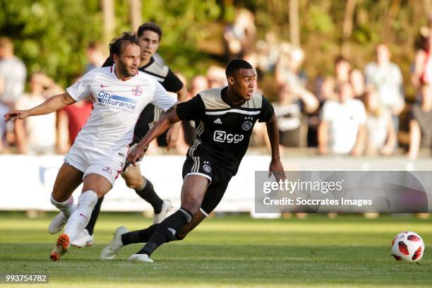 Filipe Teixeira of Steaua Bucharest, Ryan Gravenberch of Ajax during the Club Friendly match between Ajax v Steaua Bucharest at the Sportpark 't...