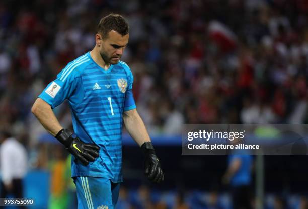 July 2018, Russia, Sotchi: Soccer: FIFA World Cup, Quarter Final: Russia vs Croatia Sotchi stadium. Igor Akinfeev, goalkeeper of Russia walks over...