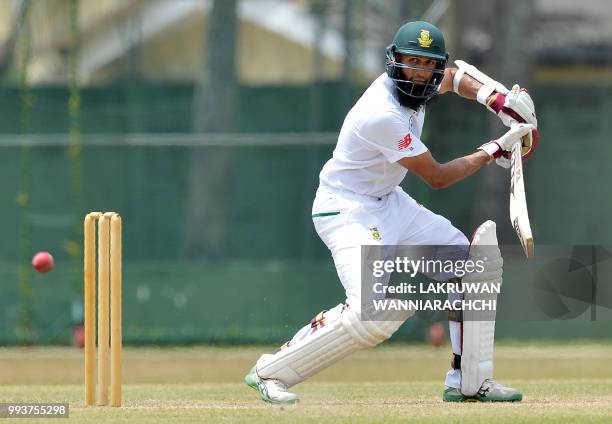 Hashim Amla of South Africa plays a shot during the second day of a two-day practice match between the Sri Lanka Board XI and South African team in...