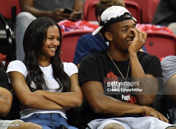 Deja Lighty and Donovan Mitchell of the Utah Jazz laugh as they attend a 2018 NBA Summer League game between the Los Angeles Clippers and the Golden...