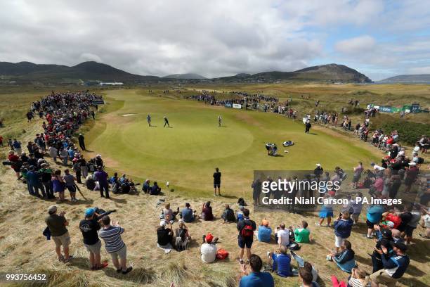 Crowds watch Northern Ireland's Rory McIlroy and England's Aaron Rai on the 11th green during day four of the Dubai Duty Free Irish Open at...