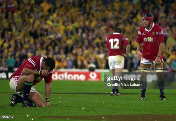 Lions captain Martin Johnson, Rob Henderson and Danny Grewcock dejected after being defeated by the Wallabies during the third Test Match between the...