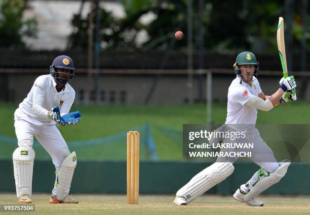 Faf du Plessis of South Africa is watched by Sri Lanka Board XI wicketkeeper Minuth Banuka during the second day of a two-day practice match between...