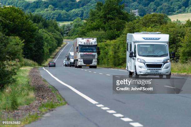 traffic on a main road in scotland - johnfscott stock pictures, royalty-free photos & images
