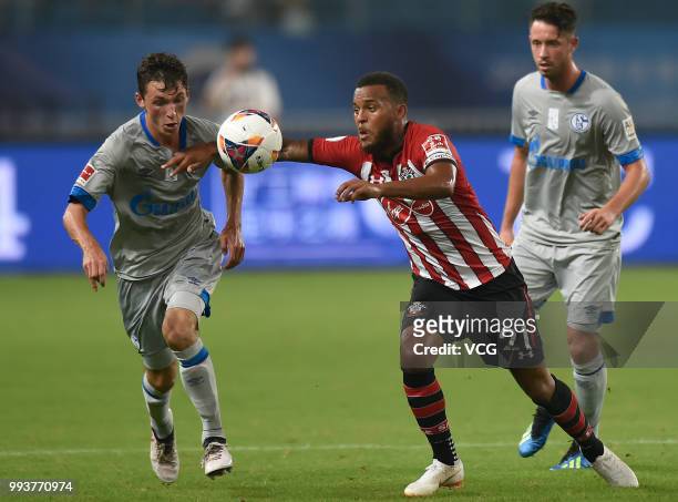 Benjamin Goller of Schalke competes with Ryan Bertrand of Southampton FC during the 2018 Clubs Super Cup match between FC Schalke 04 and Southampton...