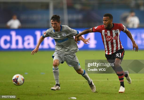 Benjamin Goller of Schalke competes with Ryan Bertrand of Southampton FC during the 2018 Clubs Super Cup match between FC Schalke 04 and Southampton...