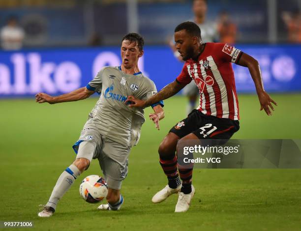 Benjamin Goller of Schalke competes with Ryan Bertrand of Southampton FC during the 2018 Clubs Super Cup match between FC Schalke 04 and Southampton...