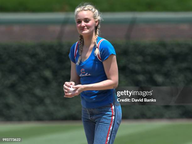 Actress AJ Michalka throws out a ceremonial first pitch before the game between the Chicago Cubs and the Detroit Tigers on July 4, 2018 at Wrigley...