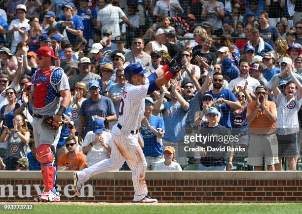 Willson Contreras of the Chicago Cubs reacts after hitting a home run against the Detroit Tigers during the sixth inning on July 4, 2018 at Wrigley...