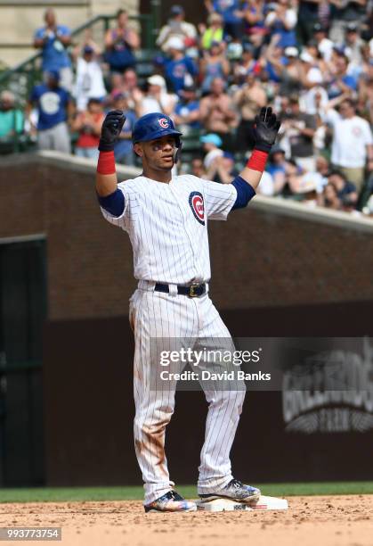 Willson Contreras of the Chicago Cubs reacts after hitting a two-RBI double against the Detroit Tigers during the seventh inning on July 4, 2018 at...