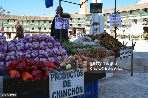 Flea market with typical vegetables in the Plaza Mayor of Chinchon, Madrid, Spain.
