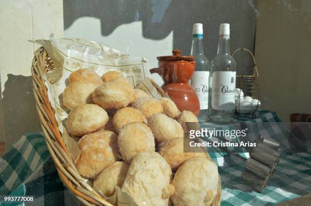 Typical products, brad and bottles of anise in a corner in Chichon, Madrid, Spain.