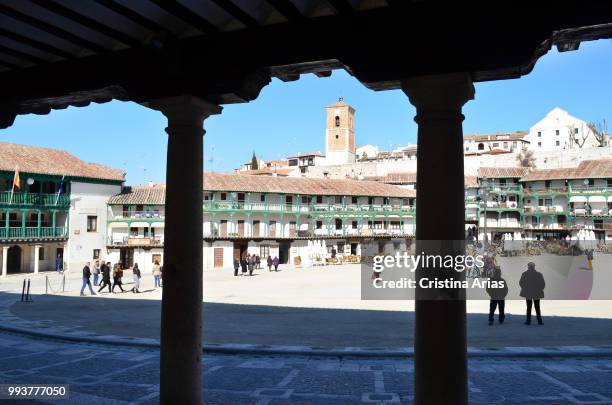 Plaza Mayor of Chinchon seen trough the arcades, Madrid, Spain.